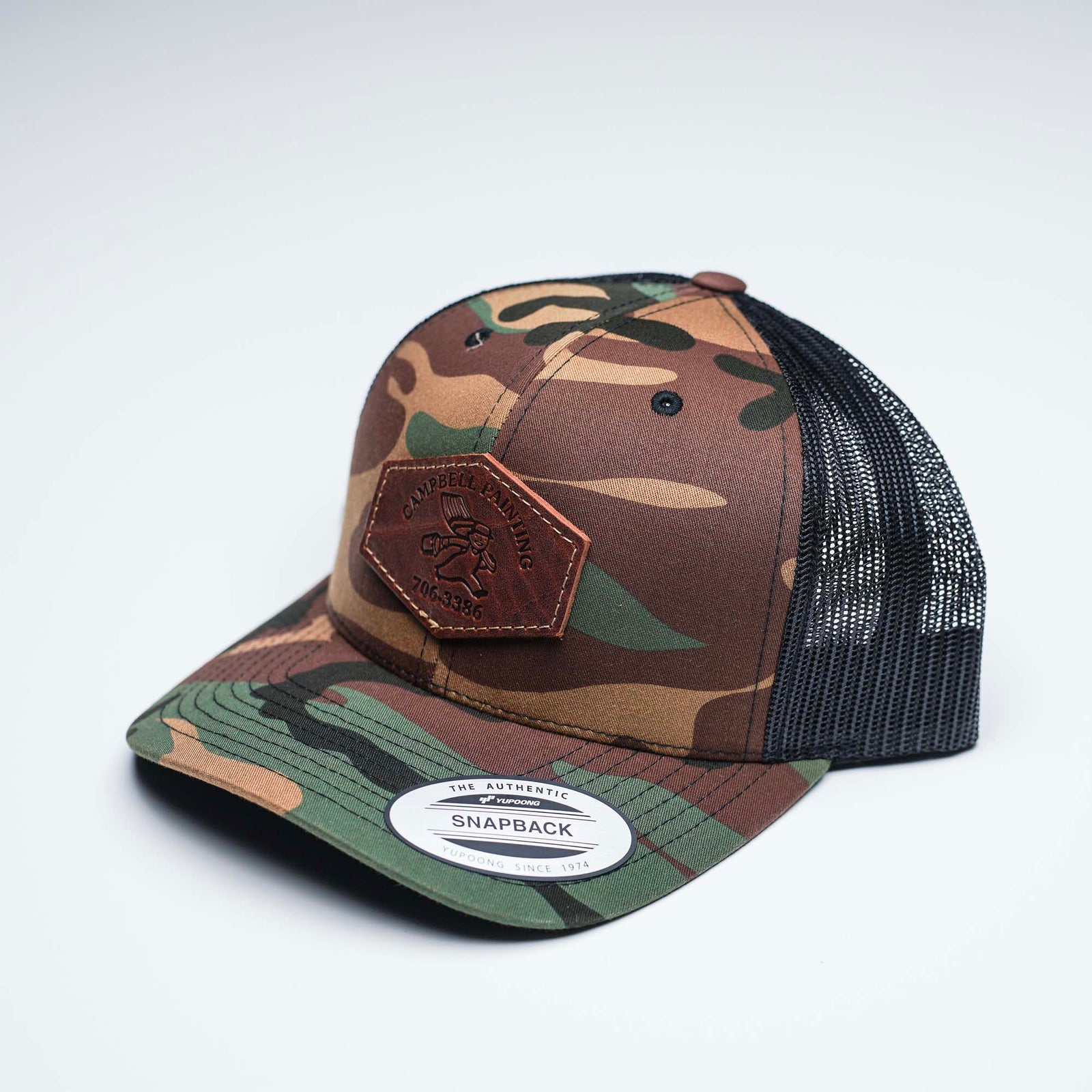 Debossed Heat Pressed - Yupoong 6606 Cap Leather Patch Camo Trucker Ha ...